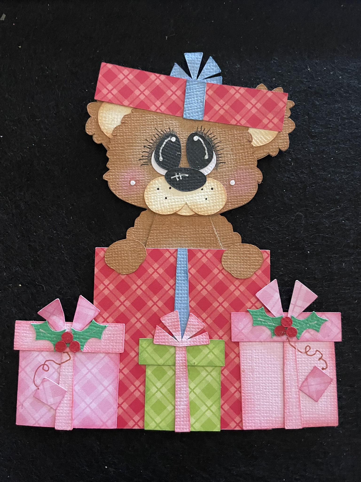 Handmade bear paper piecing holding Christmas presents